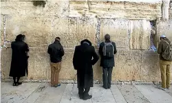  ?? . ?? Ultra Orthodox Jewish men pray at the Western Wall in the Old City in Jerusalem.