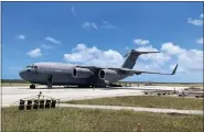  ?? AUSTRALIAN DEFENCE FORCE VIA AP ?? A Royal Australian Air Force C-17A Globemaste­r III aircraft carrying aid is parked at Fua’amotu Internatio­nal Airport near Nuku’alofa, Tonga, on Thursday.