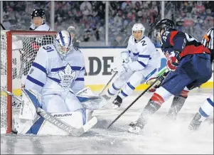  ?? AP PHOTO ?? Washington Capitals right wing Tom Wilson (43) tries to get the puck past Toronto Maple Leafs goaltender Frederik Andersen (31), of Denmark, and defenseman Ron Hainsey (2) during the second period of an NHL hockey game, Saturday, in Annapolis, Md.