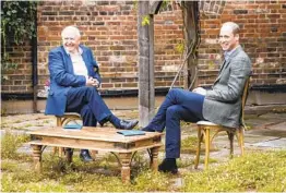  ?? KENSINGTON PALACE VIA AP ?? Britain’s Prince William (right) and Naturalist Sir David Attenborou­gh discuss the Earthshot Prize at Kensington Palace in London.