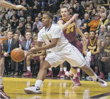  ?? | AP PHOTO ?? Purdue’s Sterling Carter passes during Wednesday’s game against Minnesota at Mackey Arena in West Lafayette.