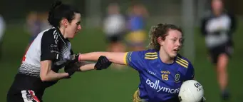 ??  ?? Aoife Morrisroe of Sligo in action with Roscommon’s Kate Harrington. Pics: Gerard O’Loughlin.