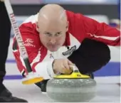  ?? ANDREW VAUGHAN/THE CANADIAN PRESS ?? Team Canada skip Kevin Koe delivers a rock against Manitoba in semifinal action on Saturday at the Tim Hortons Brier in St. John’s. Koe’s team won 7-6 to claim a spot in the final.