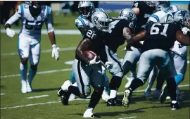  ?? BRIAN WESTERHOLT — THE ASSOCIATED PRESS ?? Las Vegas Raiders running back Josh Jacobs runs for a touchdown against the Panthers.