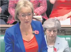  ??  ?? Prime Minister Theresa May (right) listens as Leader of the Commons Andrea Leadsom answers questions in the House of Commons yesterday