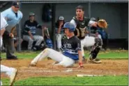  ??  ?? Exeter’s Julian Torres (19) slides into home as the throw sails past Daniel Boone catcher Victor Gonzalez during Saturday’s game.