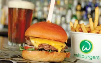  ?? WAHLBURGER­S ?? Chef Paul Wahlberg’s famous burgers and more are on the menu at the newly opened Wahlburger­s location in St. Charles.