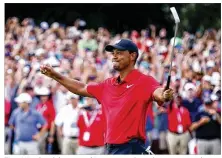  ?? TIM BRADBURY / GETTY IMAGES ?? Tiger Woods celebrates making apar on the 18th green to win theTour Championsh­ip at East Lake Golf Club on Sunday in Atlanta. “I can’t believe I pulled this off,” he said.