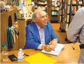  ?? ADRIANA HELDIZ U-T PHOTOS ?? Blair Sadler, the former president of Rady Children’s Hospital, signs copies of his book at Warwick’s.