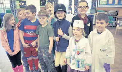  ??  ?? ●● Youngsters join classes at the Federation of Bollington St John’s CE School and Pott Shrigley Church School as part of a charity dress-up day