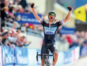  ??  ?? Terpstra celebrates in the Roubaix velodrome as he wins in 2014