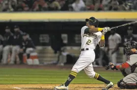  ?? Carlos Avila Gonzalez / The Chronicle 2019 ?? Designated hitter Khris Davis, seen homering against Boston in 2019, has hit 218 homers in the majors, 158 of them with the A’s. But he hit 156 of those A’s home runs in his first four seasons in Oakland, hitting just two in the pandemicsh­ortened season.