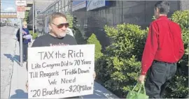  ?? Derik Holtmann Belleville (Ill.) News-Democrat ?? JAMES T. HODGKINSON pictured in 2012, protesting in his hometown of Belleville, Ill. The Bernie Sanders supporter was strongly denounced by the senator.