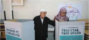  ?? - Reuters ?? EXERCISING FRANCHISE: An elderly couple cast their ballots for the referendum in Macedonia on changing the country’s name that would open the way for it to join NATO and the European Union in Skopje, Macedonia September 30, 2018.