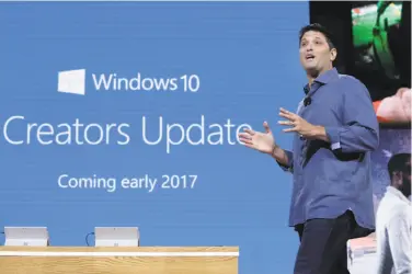  ?? Richard Drew / Associated Press 2016 ?? Microsoft Executive Vice President of the Windows and Devices Group Terry Myerson discusses the Windows 10 update last year in New York. The major update will start reaching users on April 11.