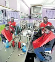  ?? Picture: ESA ALEXANDER ?? SMOOTHING THE CURVE: Fleeker, an app created by four University of Cape Town students, assists with bookings and queue management at hair and nail salons and barber shops during the Covid-19 pandemic