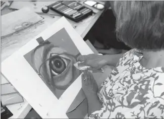  ?? Submitted Photo ?? Pastel artist Vimarie DePoyster touches up one of her art selection. Her exhibition, “Beyond Labels | Más Allá De Las Etiquetas” is now on display at the Arts & Science Center in Pine Bluff.