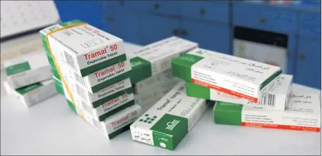  ?? ADEL HANA/AP ?? Boxes of Tramal, a painkiller that gained popularity after the first war between Hamas and Israel in 2009, are stacked in a Gaza pharmacy.