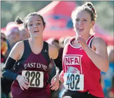  ?? SARAH GORDON/THE DAY ?? East Lyme’s Gillian Goodwin battles NFA’s Eve Buckridge to the finish during Thursday’s ECC Championsh­ip meet at Norwich Golf Course. Buckridge finished sixth and Goodwin seventh, but Goodwin helped the Vikings repeat as the team champion.