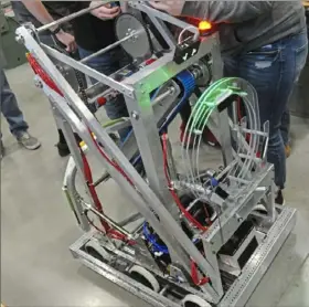  ?? Lake Fong/Post-Gazette photos ?? Members of the Chartiers Valley High School robotics team tinker with their project, Robot Eclipse.