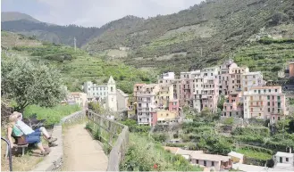  ?? CAMERON HEWITT ?? Hiking is a great way to experience the Cinque Terre, although it’s getting crowded.