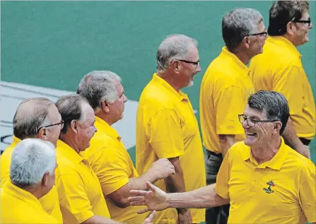  ?? CLIFFORD SKARSTEDT EXAMINER ?? Players from the 1978 Peterborou­gh Red Oaks Mann Cup champions including Tim Barrie are introduced to the fans during a pre-game ceremony prior to the Peterborou­gh Century 21 Lakers’ 10-3 win over the Cobourg Kodiaks in MSL action on Thursday night at the Memorial Centre.