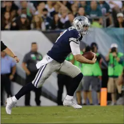  ??  ?? Dallas Cowboys’ Brandon Weeden scrambles for a first down.