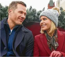  ?? Crown Media Family Networks ?? Candace Cameron Bure and Luke Macfarlane star in the Hallmark film “A Shoe Addict’s Christmas.”