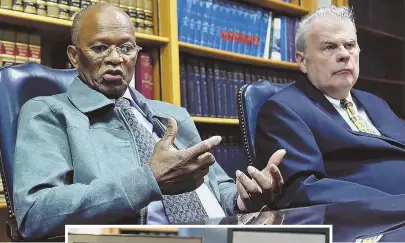  ?? STAFF PHOTOS BY CHRISTOPHE­R EVANS ?? PAIN POINT: Salvatore Furtado, above left with lawyer William Kennedy, speaks in Kennedy’s office, which has photos of Safiro Furtado and Daniel de Abreu and their graves.