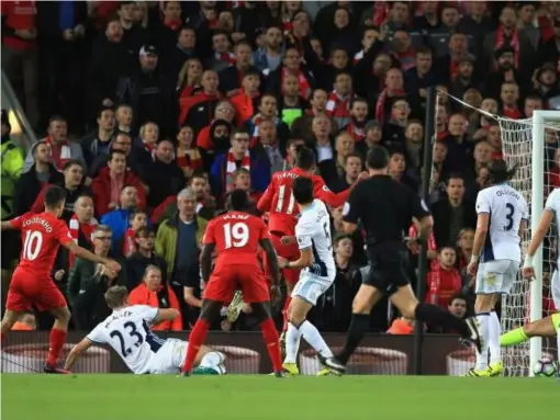  ??  ?? Philippe Coutinho (far left) scores Liverpool's second against West Brom (Getty)