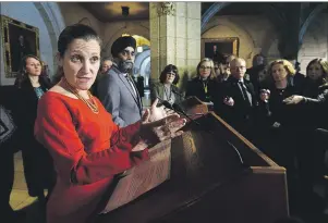  ?? $1 1)050 ?? Defence Minister Harjit Sajjan and Foreign Affairs Minister Chrystia Freeland hold a press conference in the foyer of the House of Commons on Parliament Hill in Ottawa on Monday.