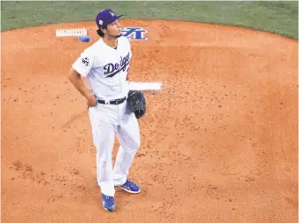  ?? Sean M. Haffey / Getty Images ?? Yu Darvish of the Dodgers didn’t record a strikeout and walked one in Game 7, his second World Series outing of less than two innings, but he says he wants to return to Los Angeles.