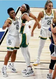  ??  ?? Baylor’s Moon Ursin, left, and East Central product Nalyssa Smith celebrate during the Bears’ 101-52 win.