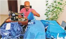  ??  ?? Indian expat Abdul Jabbar engaged in stitching PPEs for Dubai health care workers.