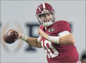  ?? Chris O'meara / Associated Press ?? Alabama quarterbac­k Mac Jones raised his NFL draft stock with a 36-for-45 passing performanc­e for 464 yards in the college title game.