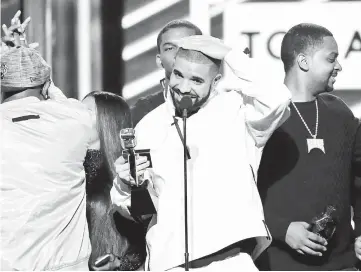  ??  ?? Drake (centre) accepts Top Artiste at the 2017 Billboard Music Awards in Las Vegas, Nevada, last May. — Reuters file photo