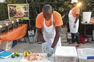  ?? Andrea Sachs / Washington Post ?? Grace Bay’s fish fry takes place on Thursday nights in Providenci­ales, or “Provo.”