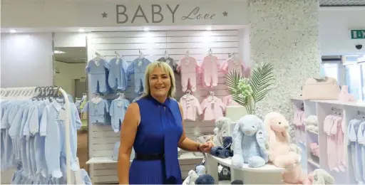  ??  ?? ● Chloe Simms the owner of Baby Love in Beales department store