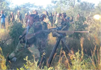  ??  ?? Troops firing ant-air machine guns during a field training exercise in Nyanga.