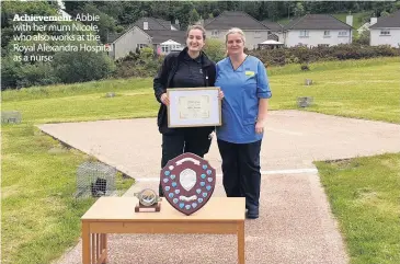  ??  ?? Achievemen­t Abbie with her mum Nicole, who also works at the Royal Alexandra Hospital as a nurse