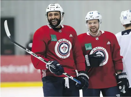  ?? PHOTOS: KEVIN KING ?? He’s not as flashy as Dustin Byfuglien, left, but Josh Morrissey has become an important part of the Winnipeg Jets’ defence corps.