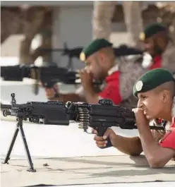  ?? ?? National Service conscripts participat­e in a military training exercise. ↑