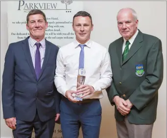  ??  ?? John Shea and Michael Conlon present Leighton Glynn of Rathnew AFC with the Overall Player of the Year Award at the Wicklow and District League Awards in the Parkview Hotel, Newtown.