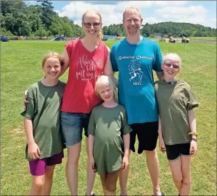  ?? Contribute­d ?? Walker County mom Jenn Smeiles, shown with her husband and children, appeared before the Walker County Board of Education on June 20 to address books with questionab­le content in school libraries.