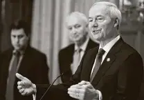  ?? Staton Breidentha­l / Associated Press ?? Arkansas Gov. Asa Hutchinson, right, is among Republican governors calling on Congress for federal economic relief.