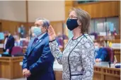  ?? EDDIE MOORE/JOURNAL ?? Sen. Mimi Stewart is sworn in as the new president pro tem of the senate on Tuesday. Stewart has been in the Legislatur­e for 26 years. At left is Sen. Benny Shendo Jr. of Jemez Pueblo.