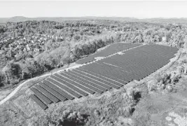  ?? Courtesy of Dimension Renewable Energy via Virginia Mercury/TNS ?? A community solar project is seen in Waynesboro, Virginia. Lawmakers in many states, including Virginia, have passed or are considerin­g bills to enable community solar projects, which allow people to buy into local projects and receive credit on their electricit­y bills.