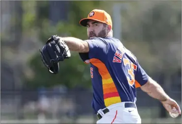  ?? KAREN WARREN — HOUSTON CHRONICLE VIA AP, FILE ?? Astros pitcher Justin Verlander warms up as he prepared to throw during spring training workouts on Feb. 15 in West Palm Beach, Fla.