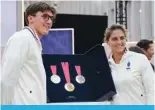  ?? ?? PARIS: (From L) French Paralympic swimmer Alex Portal and French wheelchair tennis parasport athlete Pauline Deroulede pose next to the Paralympic medals during the unveiling of the Olympic and Paralympic medals for the Paris 2024 Olympic Games, in Paris. — AFP