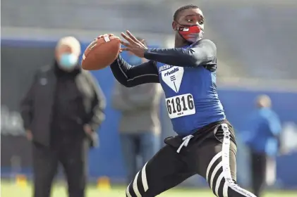  ?? JOE RONDONE/THE COMMERCIAL APPEAL ?? Jalen Wright, a senior from Memphis East, throws the ball during a drill at the Shelby County Schools Autozone Liberty Bowl High School Showcase on Saturday, Nov. 14, 2020.